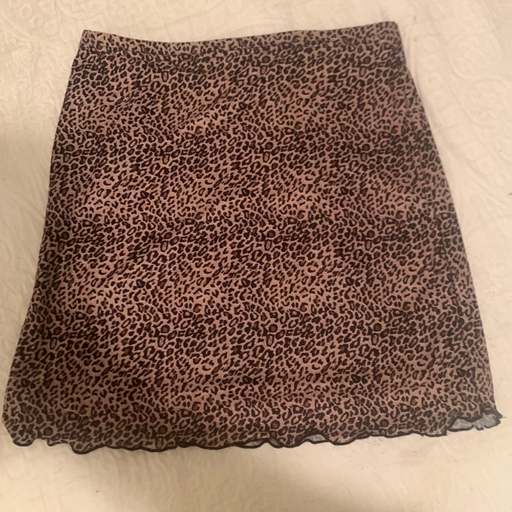 mini skirt leopard print size small. underlining not sheer,stretchy, never worn
